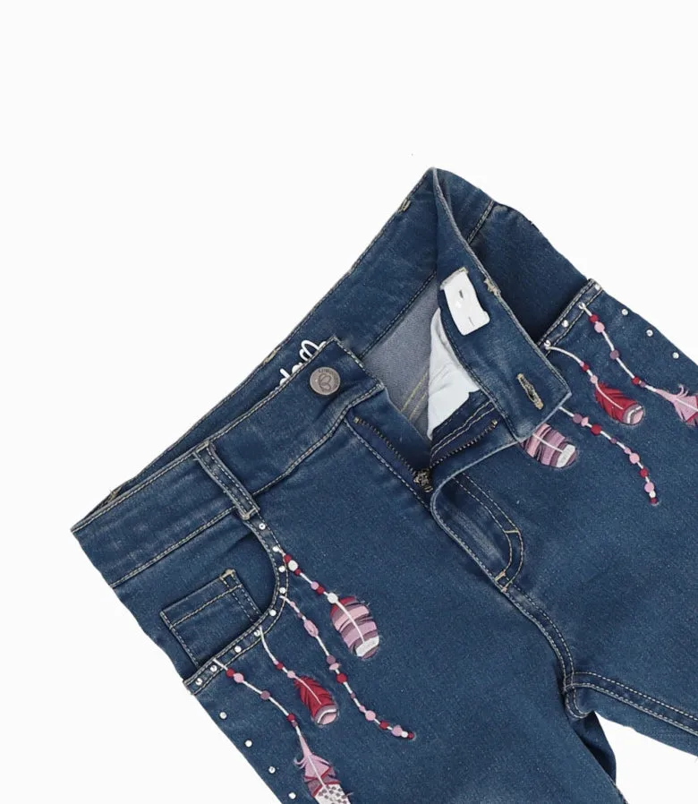Jeans Niña Con Plumas Y Brillos